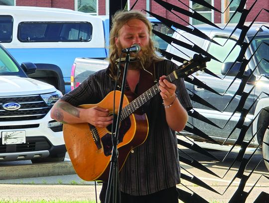 Award winning blues artist Joe Waters performed during the Main Street Chanute Farmers Market