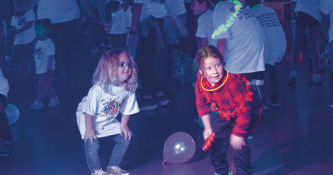 Families dance the evening away during Baby Rave Families dance the evening away during Baby Rave