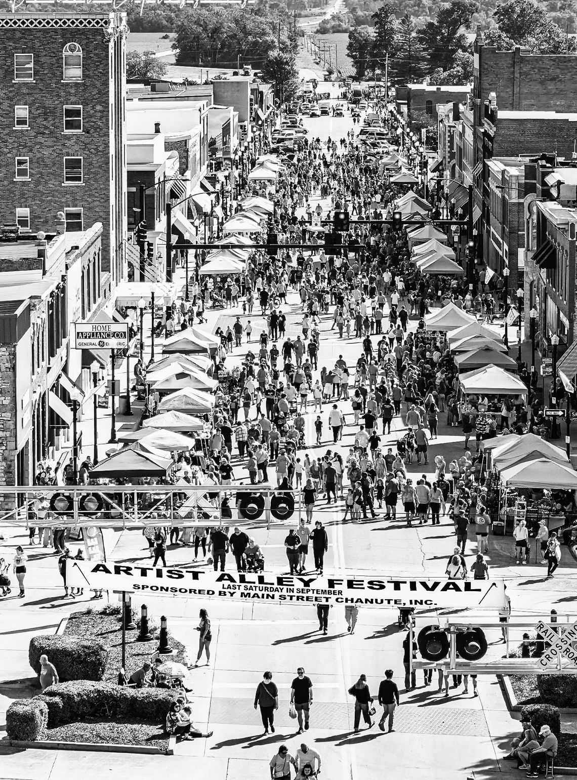 Hundred gather in downtown Chanute ahead of the Artist Alley Parade