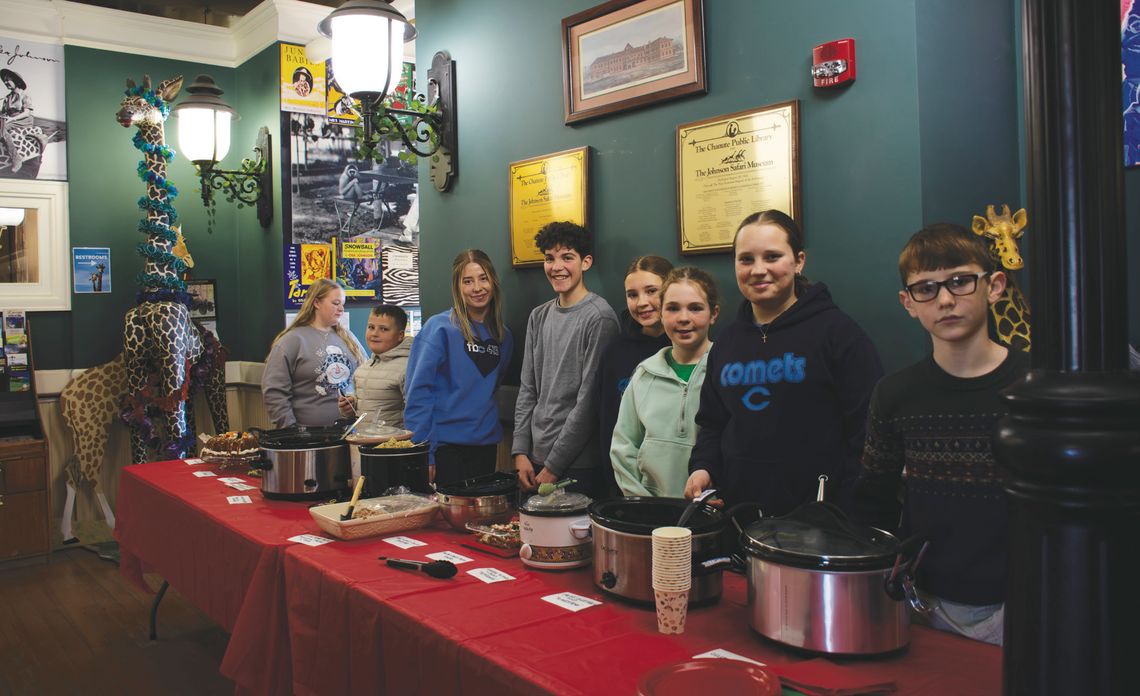 Members of the Neosho Valley Busy Bee 4H Club served the Italian dishes they prepared for the 35th annual International Tasting Tea that they have held with the Safari Museum