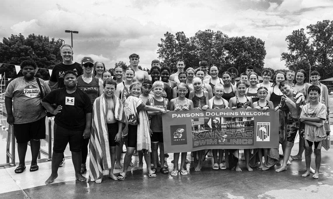 Sharks travel for KU swim clinic